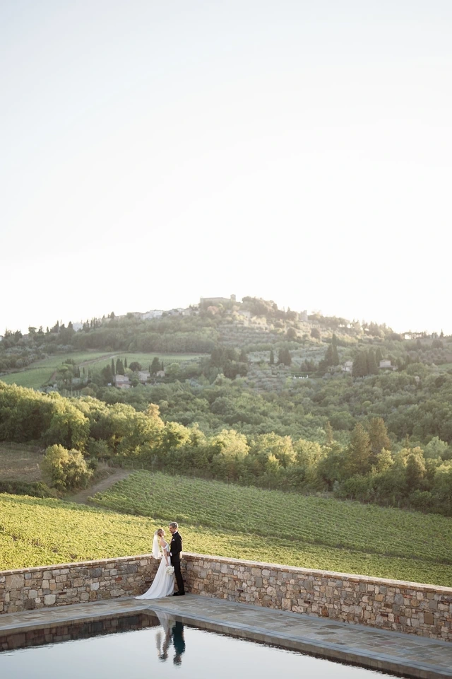 Newlyweds overlooking the vineyards of Greve in Chianti, Tuscany, after the ceremony.
