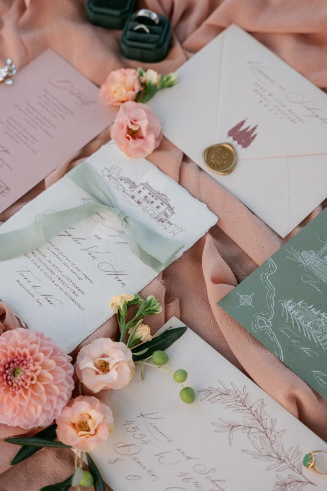 Romantic stationery design with colored paper and calligraphy elements by Floé Weddings.