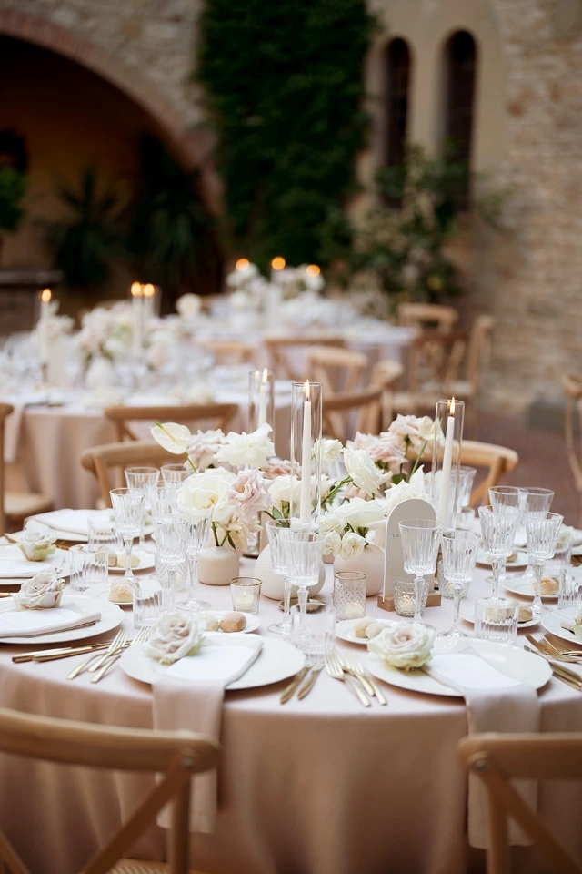 Delicate table setup with white and blush candles and rose by Floé Wedding at Castello il Palagi, Tuscany