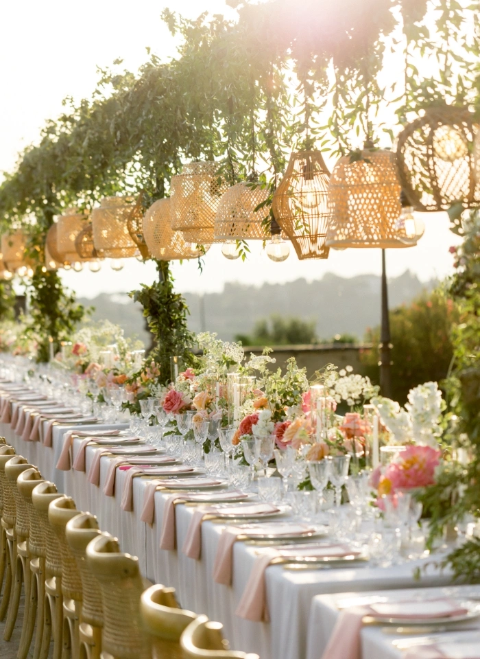 Imperial wedding table with pink flowers and bamboo lampshades at Villa di Maiano