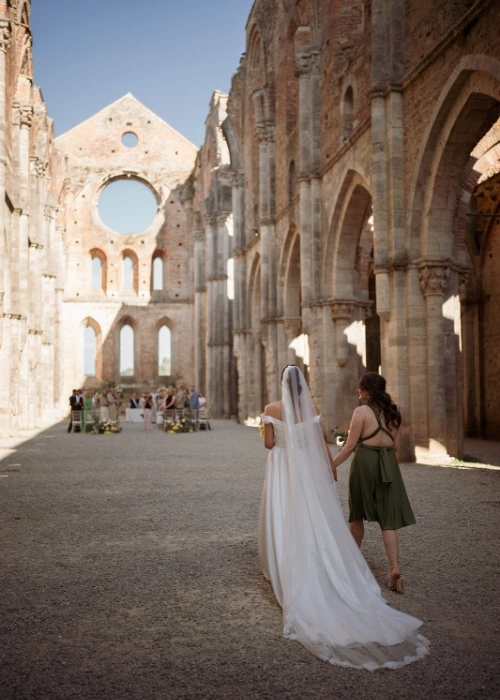 Bride walks down the aisle with sister for legally binding ceremony at San Galgano