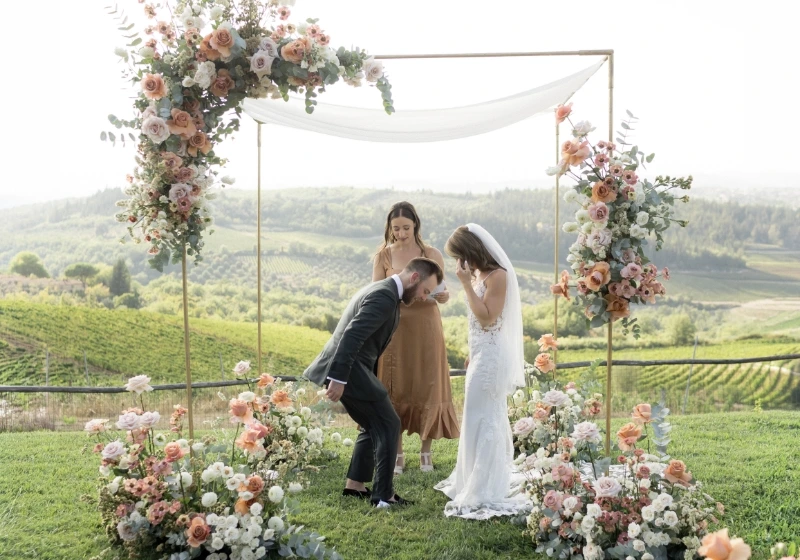 Groom breaking the glass after religious Jewish wedding ceremony outdoors in Tuscany