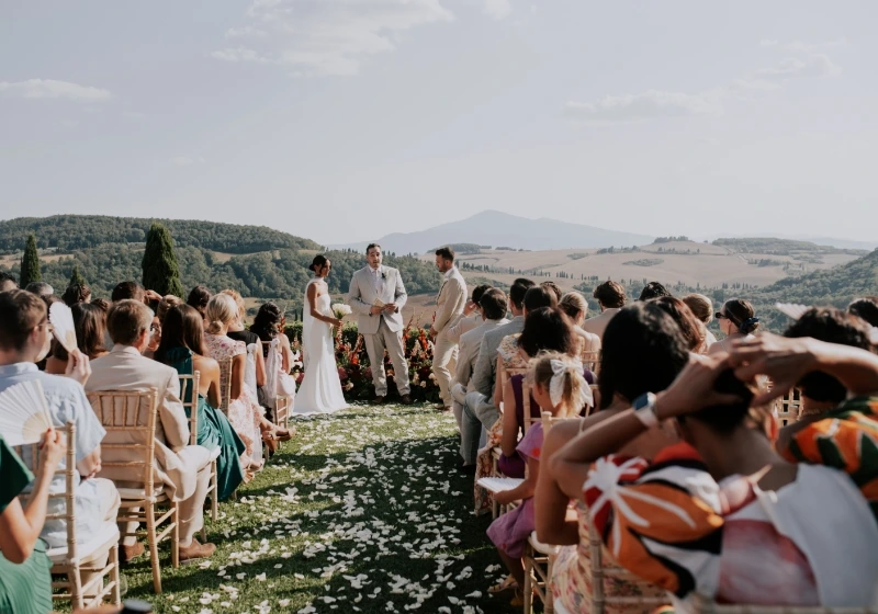 Symblic outdoor wedding ceremony with Tuscan hills as backround