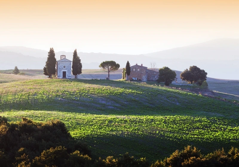 Overview of the chapel of vitaleta in the middle of open fields