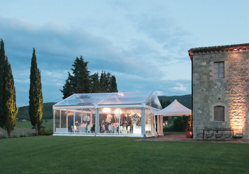Photo of a dinner in a tent in the garden 