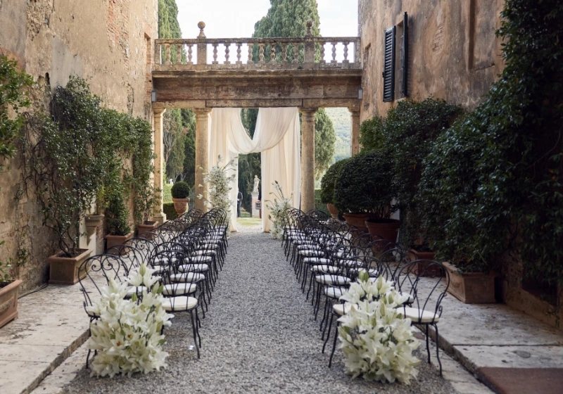 A ceremony in front of the coloumns, an architectural space.