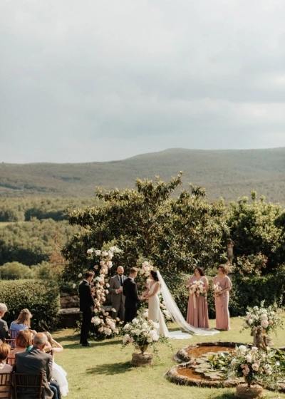 Photo of a wedding ceremony behind the fountain of Borgo stomennano