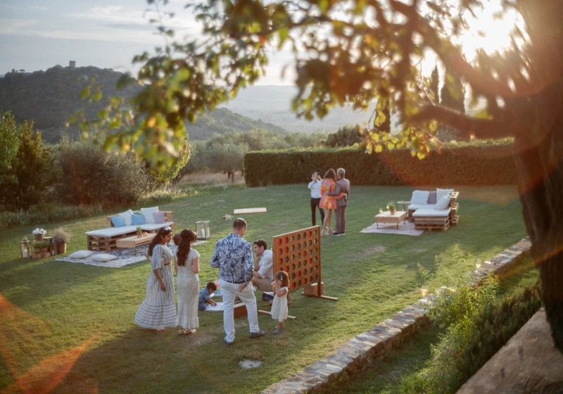 Photo of some guest of an intimate game playing games in the garden