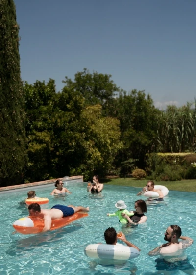 Some guest in the pool doing a wedding pool party