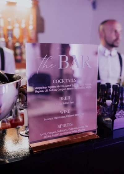 A personalized bar sign for cocktails on the open bar