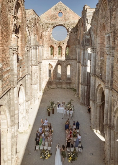 Aerial view of a romantic wedding ceremony at San Galgano Abbey