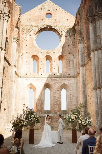 Wedding ceremony inside San Galgano Abbey in Tuscany