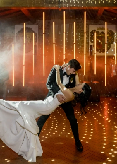Bride and goom dancing at their wedding party at Castello di Gargonza