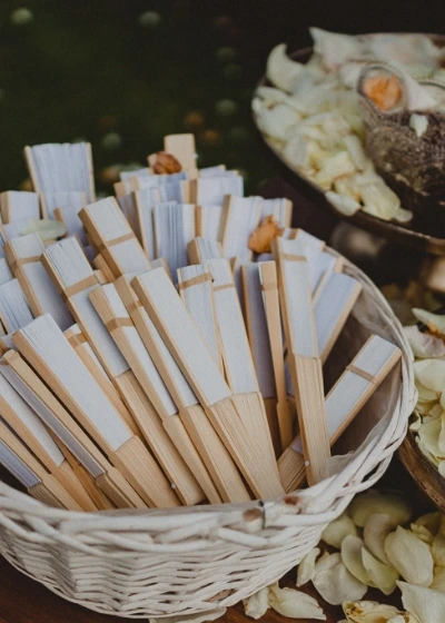 Paper fans for a summer ceremony under the sun 