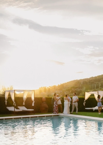Time by the pool in a wedding day at sunset hour